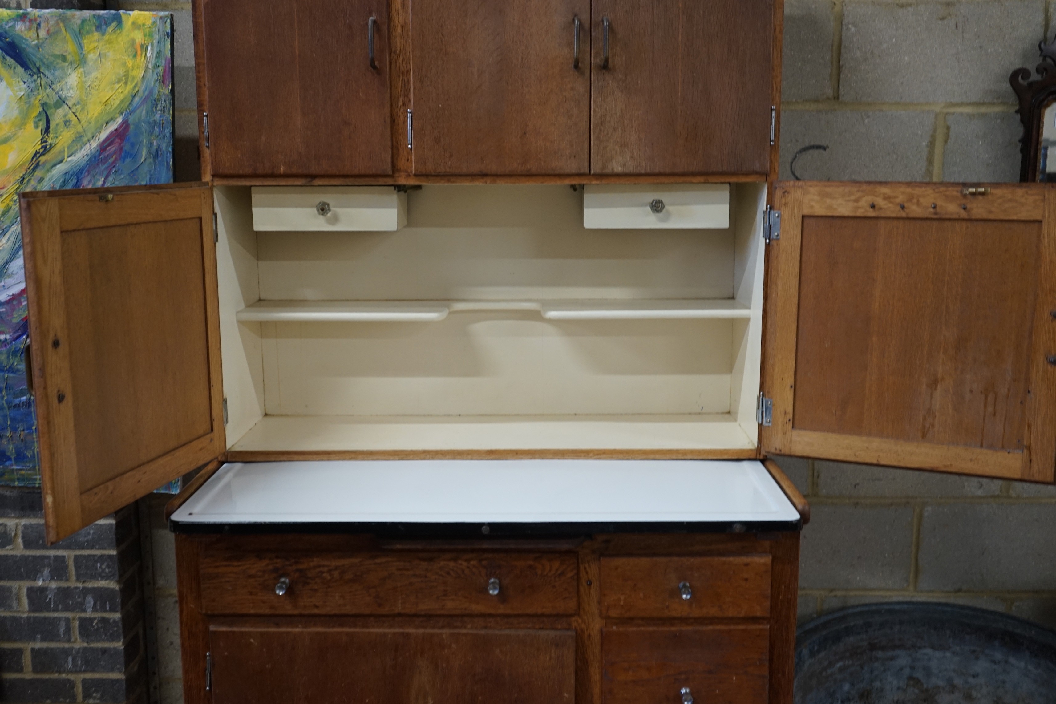 An early 20th century oak 'Easiwork' enamel top kitchen cabinet Streamline Deluxe model, length 110cm, depth 64cm, height 198cm